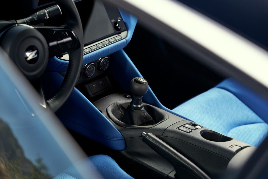 2024 Nissan Z blue interior showing manual transmission gear shifter